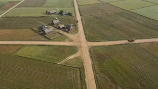 Timelapse prompt on Seedance 2 : Locked-off aerial timelapse of the exact same landscape across centuries, with the came