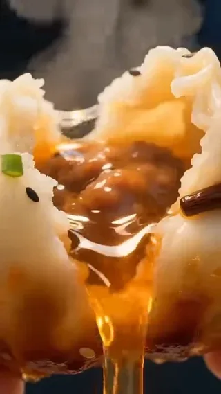 Cinematic slow-motion video of shengjianbao being prepared and eaten, highlighting crispy crusts, juicy fillings, and steaming broth with extreme close-ups and soft, warm lighting.