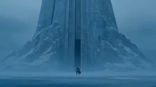 A lone warrior in frosted armor stands before a colossal, intricately carved ice gate in a snowy mountain, drawing a glowing sword as shadowy figures emerge from a blizzard on a frozen lake.