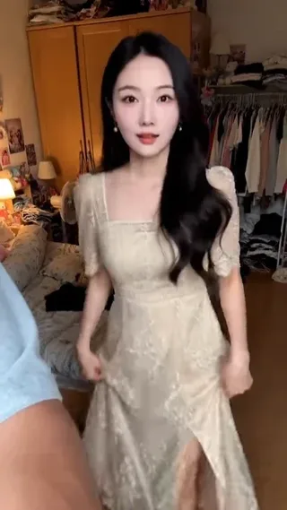 First-person POV video of a beautiful Chinese girlfriend trying on a new dress and playfully winking at the camera.