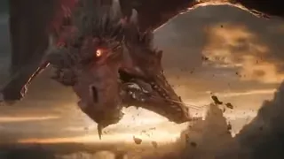 Armored knight on a cliff facing a colossal crimson dragon during a golden hour storm, with sparks flying from their clash.