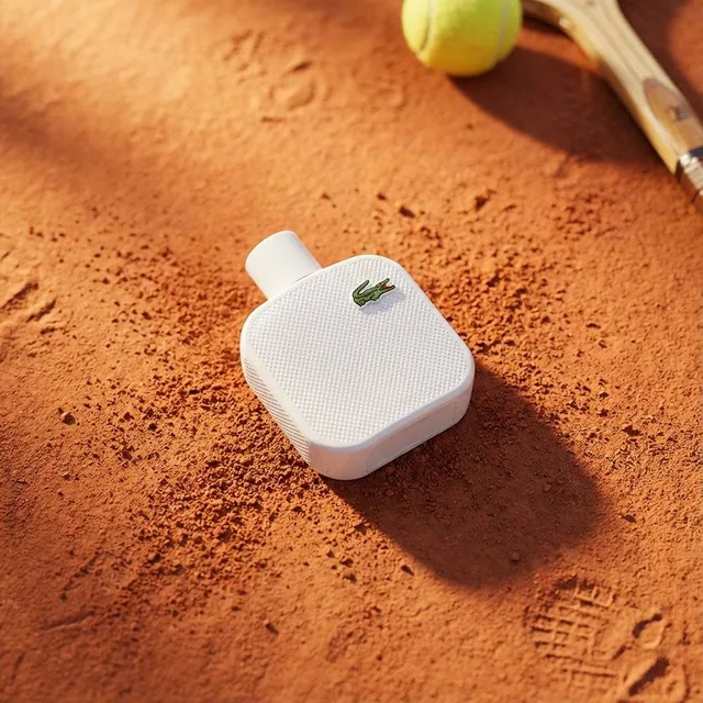 A high-end editorial photo of a [PRODUCT] placed flat on a [TEXTURED SURFACE], captured from a direct top-down view. The
