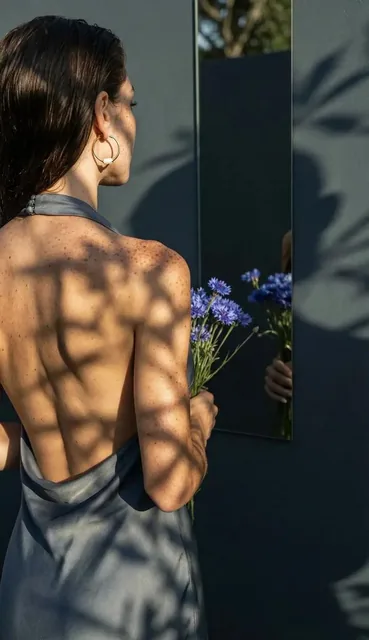 A professional, high-end photograph emphasizing the physical interplay of light and shadow on real surfaces.