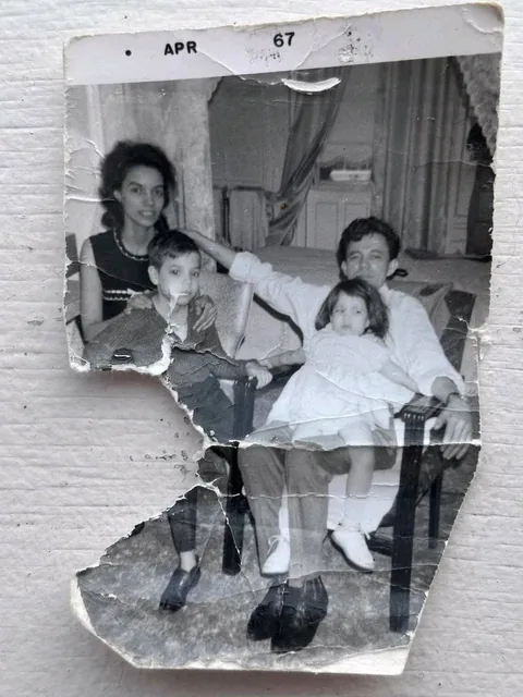 Cinematic portrait restoration. Strictly preserve original pose, expression, and composition. Add warm golden-hour side