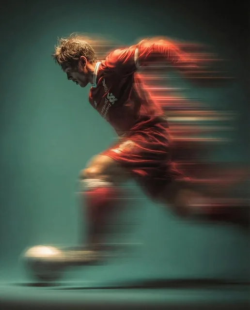 Panning shot of a mysterious soccer player in red proffesional soccer jearsy mid air kicking a ball, motion blur, cinema