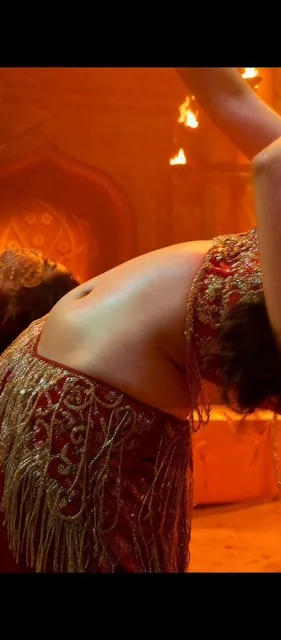A close-up, high-fashion cinematic portrait of a beautiful South Asian woman with defined features, dark brown eyes, and