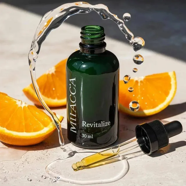 Ultra-realistic premium skincare serum bottle (dark green glass with dropper), golden liquid inside, placed on sunlit ma