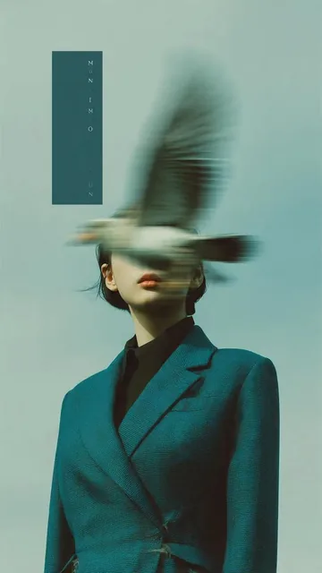 Editorial photography, a woman wearing a structured deep teal blazer standing against a pale blue sky. A bird in heavy m