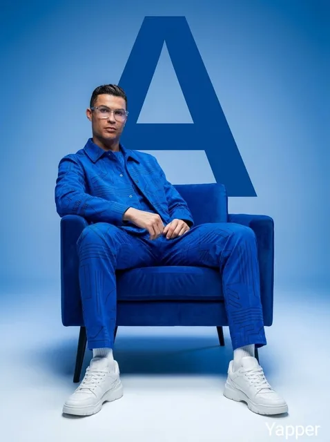 Minimalist fashion studio photoshoot featuring stylish people sitting confidently on a modern chair, monochromatic aesth