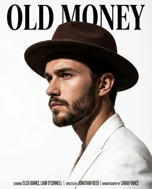 A cinematic magazine-style portrait of a handsome man in side profile, wearing a brown felt fedora hat and a cream-color
