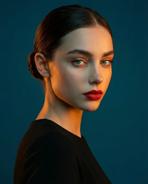 A studio portrait, medium shot of a