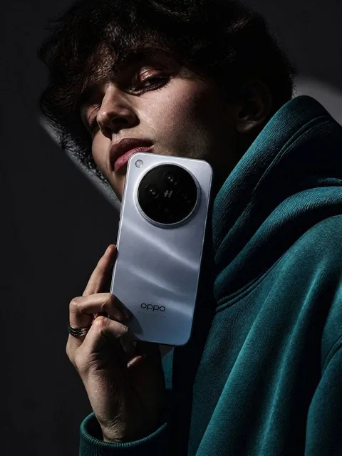 A stunning high-fashion advertisement photo of a young woman wearing a deep teal oversized hoodie with black and white g