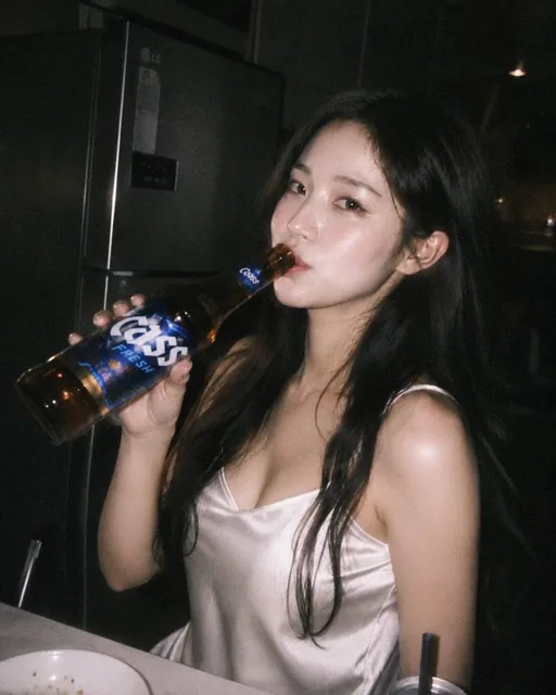 Ultra-realistic candid night photography of a beautiful East Asian woman with long black hair wearing a silky white sati