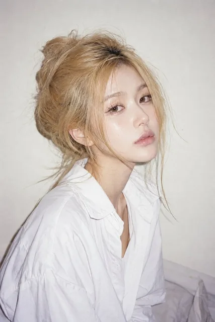 Photorealistic candid portrait of a beautiful woman against a clean white background, refined delicate makeup, elongated