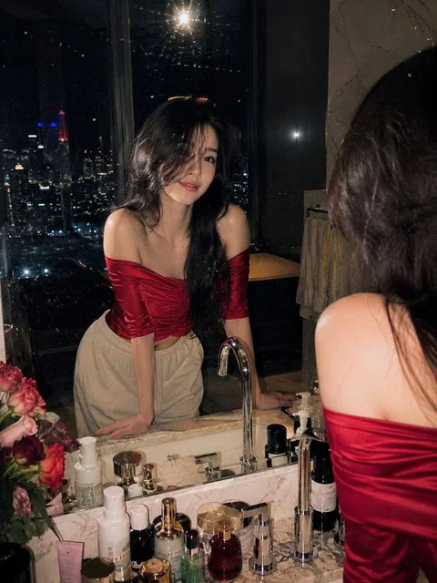 Ultra-realistic cinematic night portrait photography of a beautiful young woman standing at a luxury marble bathroom van