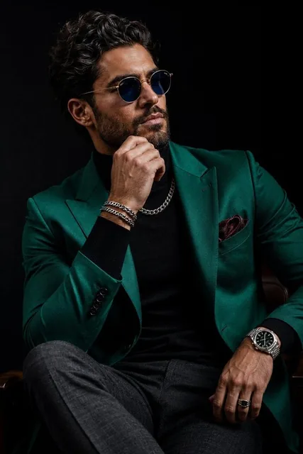 Ultra-realistic luxury menswear editorial portrait of a confident, handsome man with thick textured dark hair, sharp jaw