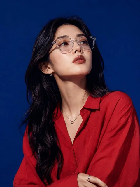 Ultra-realistic high-fashion studio portrait of a beautiful young East Asian woman with long wavy black hair, wearing tr