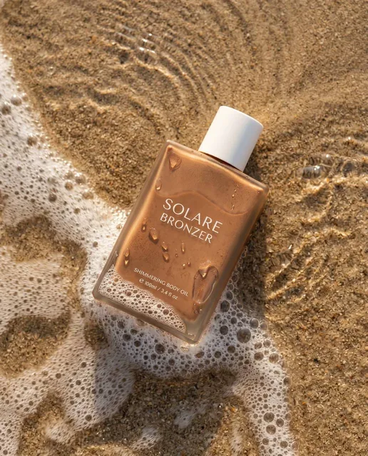 Ultra-realistic summer beauty product photography: bronzer bottle. Rectangular matte bottle in a warm bronze shade with