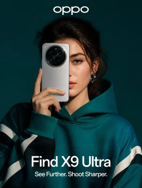 A stunning high-fashion advertisement photo of a young woman wearing a deep teal oversized hoodie with black and white g