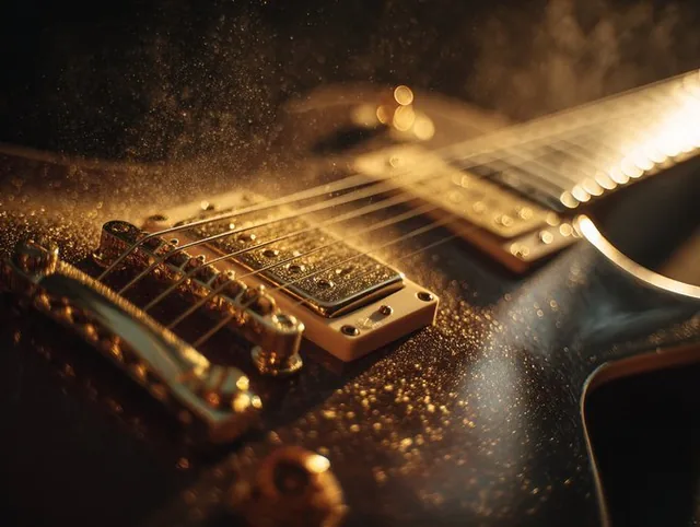 A sculptural electric guitar with gold hardware is bathed in warm golden light, with fine gold dust drifting across its strings. The scene exudes opulent richness and a wealth aesthetic, featuring warm highlights and deep shadows in an indulgent luxury photography style.