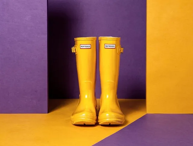 A product placed within a bold, graphic environment of solid color blocks with hard edges, featuring a complementary or contrasting color scheme, influenced by pop art and graphic design with flat lighting and striking simplicity.