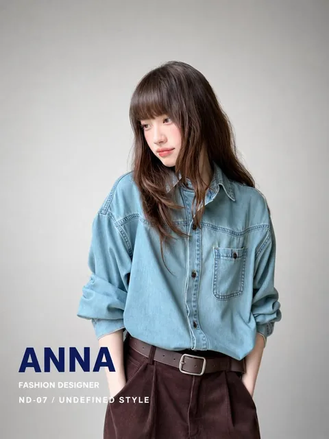 Formal business profile portrait poster of Yuzuna Koizumi, Senior Graphic Designer, looking confidently at the camera against a pure white background with her name and title at the