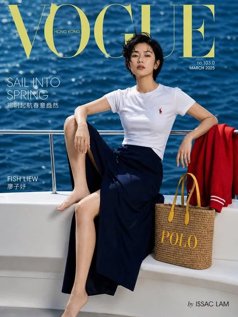 A Vogue Hong Kong magazine cover featuring East Asian model Fish Liew on a white luxury yacht, wearing a Ralph Lauren polo and navy skirt, with ocean background and Vogue masthead.