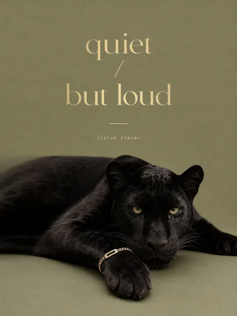 A high-end minimal banner featuring a panther positioned horizontally across the lower frame, body slightly turned with head facing forward and front paw resting toward center, calm yet powerful pose with subtle motion blur, solid light olive background, thin gold bracelet naturally wrapped around t