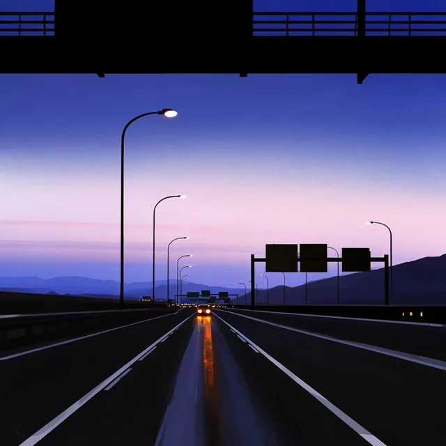 Multi-lane highway at twilight from a low ground-level angle, framed by black silhouettes of an...