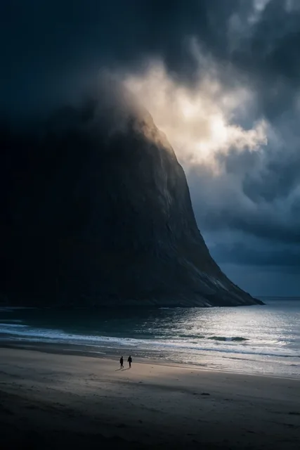 Massive dark mountain plunging into the ocean, mountain peak shrouded in heavy glowing fog and...