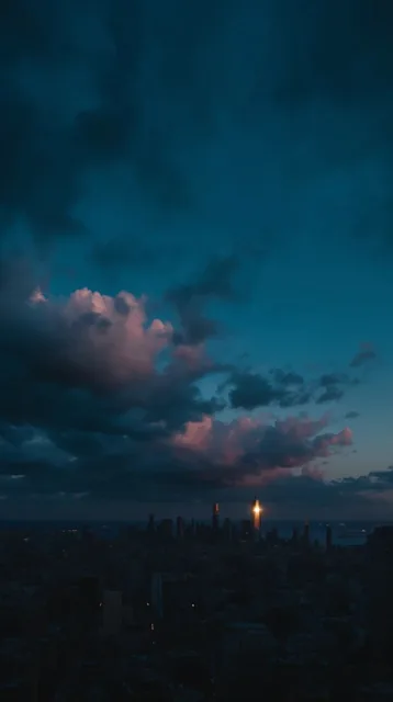 ultra-wide panoramic twilight cityscape, vast dramatic deep blue sky, heavy moody clouds with p...