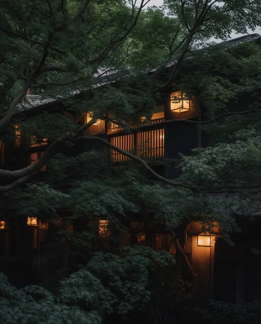 A traditional dark-facade building is enveloped by dense, deep green foliage under moody twilig...