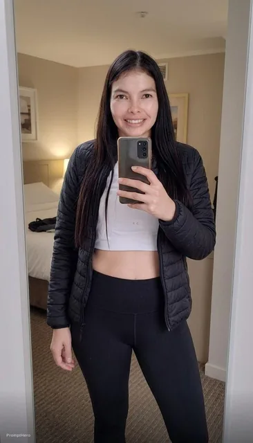 the girl takes a photo with her phone of herself in the mirror, she has 24 years old, has...