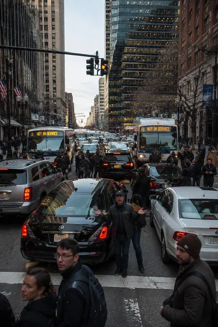 Short vertical video clip of a realistic city suddenly experiencing confusion during morning rush hour, traffic lights m