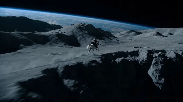 Open on a majestic lunar landscape under black sky, silver dust exploding under the hooves of a lone white horse gallopi