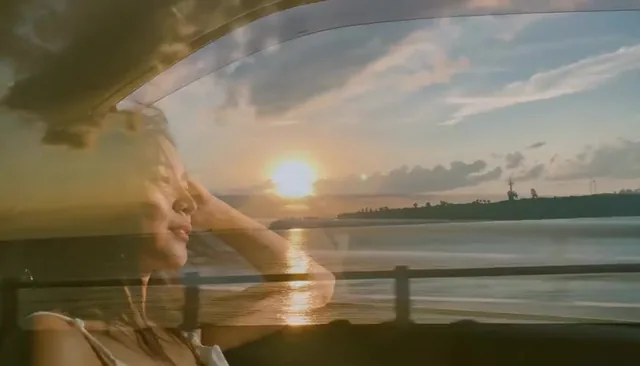 Cinematic video montage of summer travel memories, featuring a young woman in a car, golden sunsets, beach scenes, tropical streets, and underwater shots with a sea turtle.