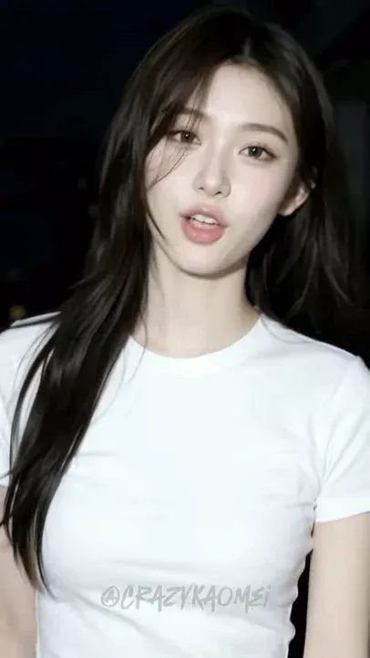 A young woman with dark hair, wearing a light-colored top, sings and walks backward. She snaps her fingers, and the dark background transitions smoothly into a bright daylight scene as she smiles.