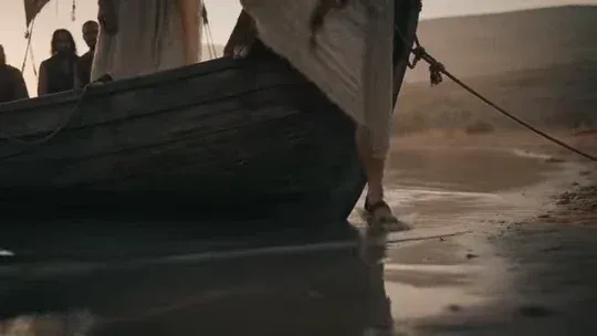 Cinematic wide shot of a couple on a sailboat at sunrise, then offering compassion to a chained man in a desert, and finally reading a book together.