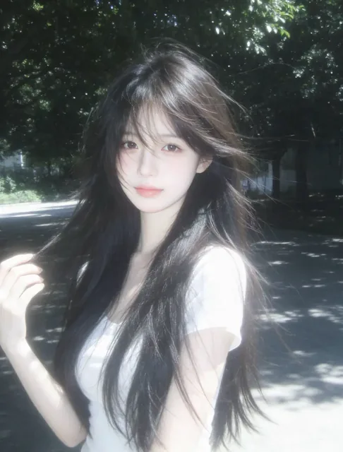 A hyperrealistic, doll-like girl with long hair, looking shyly at the camera, bathed in dappled sunlight and ethereal, shifting light, captured in a candid, slightly blurred, low-s