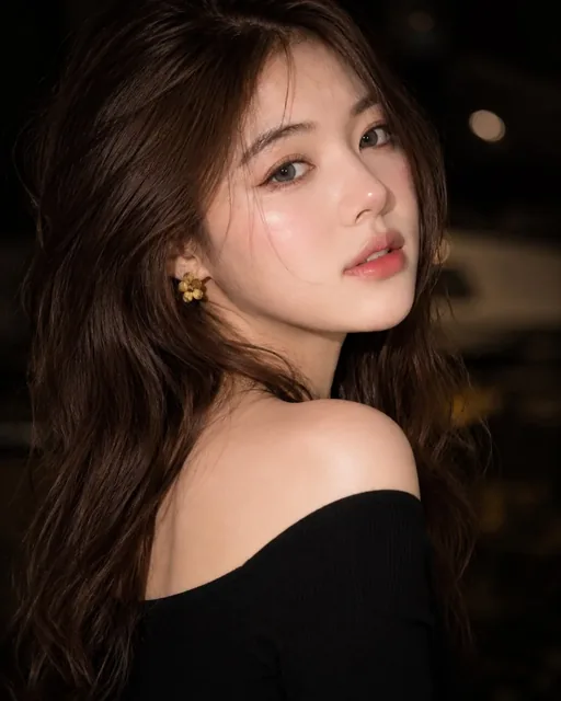 Ultra-realistic close-up beauty portrait of a young woman with closed gray-blue eyes, flawless glowing porcelain skin, and long wavy brown hair framing her face. She wears a black off-shoulder top and yellow flower earrings.