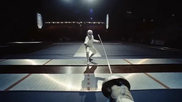 POV of a fencing match, opponent lunging, blades clashing and sparking.